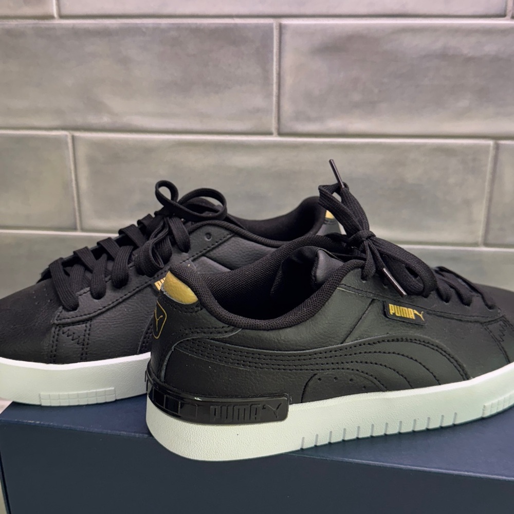 Puma black and gold platform sneakers Women’s size 6.5 NWOT